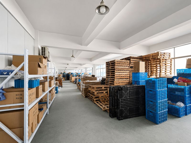 Fishing reel components organized in the production storage area Fishing reel components organized in the production storage area